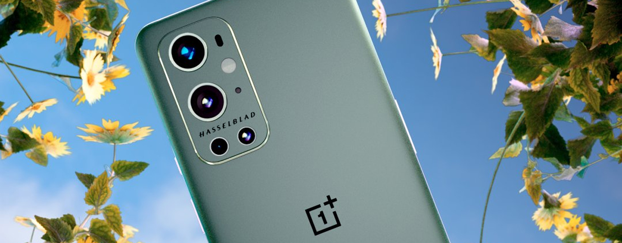 oneplus 9 pro and watch in front of sky and flowers