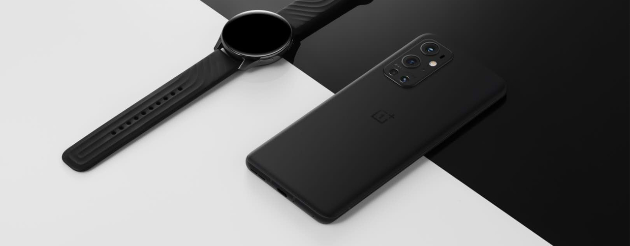 oneplus 9 pro and watch on black and white surface