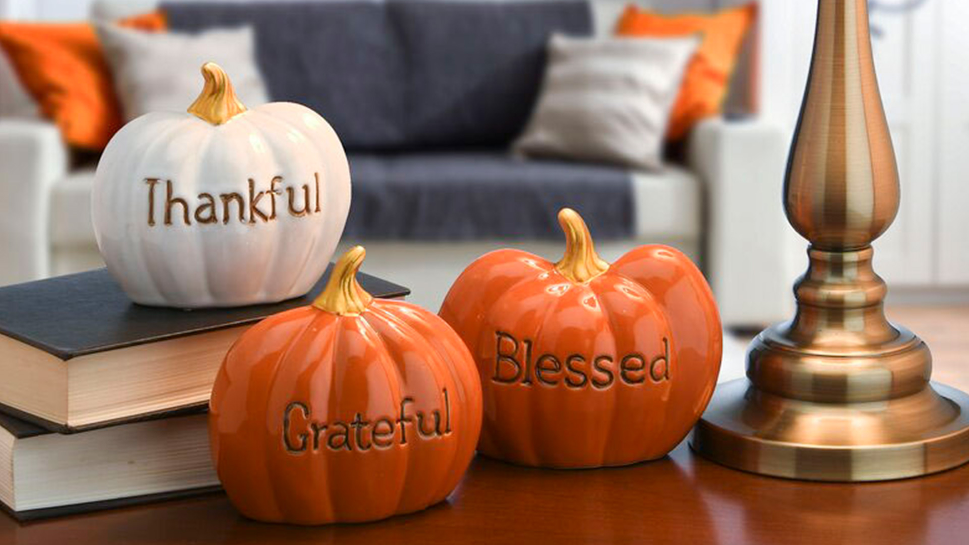 decorative ceramic pumpkins on a table
