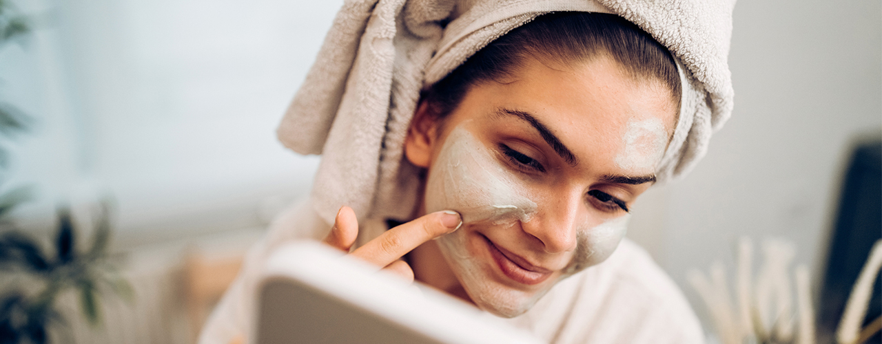 woman applying a face mask